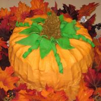 Pumpkin 2 pumpkin spice bundt cakes stuck together frosted with cream cheese icing, leaves done in fondant. Did this one for fun, thanks for...