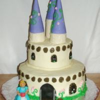 Castle And Princess Chocolate cake filled with buttercream, covered with buttercream with fondant detail. Princess is made out of fondant. Turrets are ice...
