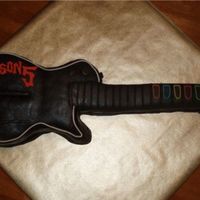 Guitar Hero This cake was made for a friend's son's 5th birthday. This is my first attempt at chocolate MMF and I definately learned a lot...