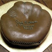 Baseball Mitt Chocolate fondant with buttercream detail. This was baked in a pyrex bowl and carved to shape.
