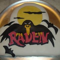 The Raven Here is a picture of my very first cake that I decorated with fondant. I used store bought stuff because I was unfamaliar with the texture...