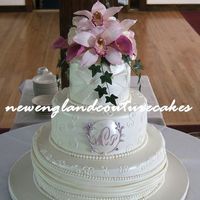 Orchids The details on this wedding cake is a combination of elements from the invitations and bridal gown. The flowers are gum paste and were a...
