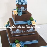 Chocolate Splendor This is one of 4 cakes from last saturday. The bow topper, and flowers were made out of gum paste and the filigree pattern is royal icing....