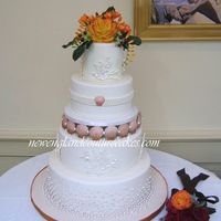 Elegant Seashells I delivered this one on Friday. The seashells are white chocolate, corals are royal icing, pearls are fondant. The topper is gumpaste.Thaks...