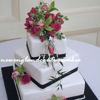 Off-Set Squares This is the cake from yesterday, white fondant and pearls with gumpaste roses, orchids, hypericum berries and jasmine. thanks for looking