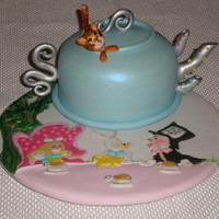 Mad Hatters Tea Party Teapot is cake other decors have been flooded