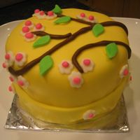 Blossom 6 inch, 2 layer lemon cake covered with fondant.