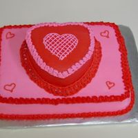 Valentine's Cake For Work This cake had a lot of firsts for me. It was my first stacked cake, my first time doing some freehand work- the hearts, and my first...