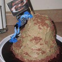 Gali Climbing The Mountain. My son wanted a bionicle cake, and went to a rock climbing wall for his party, so I combined themes. Shaped cake with buttercream and...