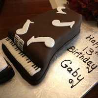 Piano Cake This is a chocolate cake I made in the shape of a baby grand piano for a friend's birthday. It's all chocolate covered with...