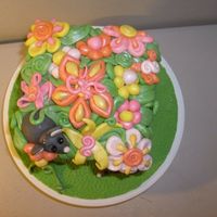 Flowers This is another view of my dummy cake where I practiced fondant for my first time. I wanted to do soem fantasy type flowers, not quite...