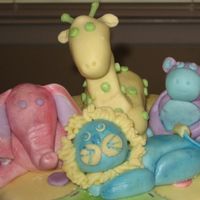 Animal Friends Baby Shower (Close-Up Animal View) This is a close-up of the animals on my Animal Friends Baby Shower cake. Animals are MMF mixed with gum tex powder and painted in luster...