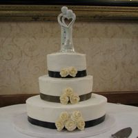 12", 8" 6" Buttercream Round This is as stated above. Filled with strawberry filling and white cake. The bride brought the ribbon to match her colors.