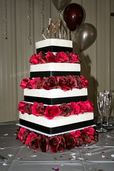 Cassandra's Elegance 4-tier square wedding cake adorned with black ribbons and silk maroon roses. Flavors: wedding white, chocolate and strawberry with white...