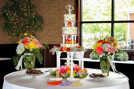Heather's Garden Basket weave fountian garden wedding cake surrounded by fresh flowers of summer