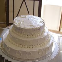 Wedding Cake 10" chocolate, 8" vanilla, & 6" chocolate all with coconut filling and iced in vanilla bc. Not totally impressed with...