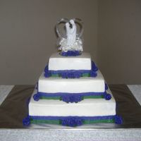 First Wedding Cake 3 tier with butter cream icing and roses.