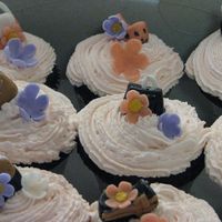 Purse Cupcakes Cupcakes done for a friends purse party. . Cupcakes are all dark chocolate with vanilla cream filling insideFrosted is homade whipped cream...