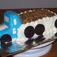 Truck Cake My first attempt at a truck; my sister wanted a different icing. It was too soft and was sliding off the cake. It was for a truck drivers...