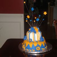 Shoot For The Stars! Strawberry buttercream and MMF over french vanilla cake. Gumpaste plaque and fondant stars on floral wire. This cake was so much fun!