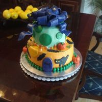 Halloween Birthday Cake this cake is buttercream with fondant accents and a fondant/gumpaste bow. the candycorn is actual candy and the pumpkins and tombstones are...
