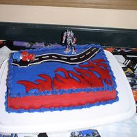 Dsc05056.jpg Transformers. The red flames didn't quite work out.....they smeared with the blue. And one of the birthday guests poked the road:)