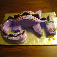 Purple Dinosaur Not Barney This is a cake of a purple dinosaur done for a birthday party.