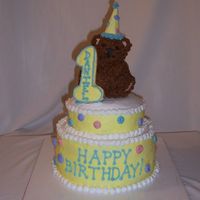 Teddy Bear Birthday This cake was done for a little boy turning one. The design is adapted from a Wilton Yearbook photo - not sure which year. TFL!