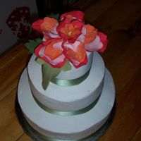 Gumpaste Flower Wedding Cake This was my first wedding cake, done for a wedding last Sunday. The gumpaste flower was inspired from a piece of fabric provided by the...