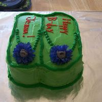 Flip Flop Bday Cake i did a 2 layer 8inch pan cake. i cut it to look like flip flops. its all buttercream, with fake flowers