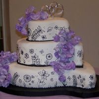 Paisley Wedding Cake my first wedding cake! can't take credit for the design, the bride chose it from a wilton yearbook. it's fondant with RI details...