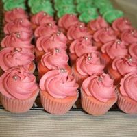 Mini Cupcakes These were made for a graduation luncheon. They were colored to match the invitations, pink and green. Strawberry with vanilla bc.