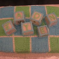 Baby Shower Block/quilt Cake This cake was made for a baby shower -devil's food with vanilla bc. The blocks were cut from a square cake and covered with rolled...