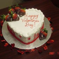 Heart Shaped Cake Chocolate Cake with BC filling. Strawberries dipped in chocolate and white chocolate stripes.