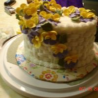 Pansy Cake This is my first fancy cake Ive made in my Wilton classes. The camera angle is off so it looks a little odd and the colours didnt come...