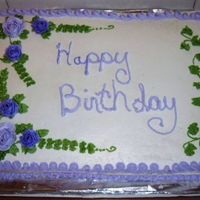 Mom's Big Birthday Cake White and yellow cake with buttercream frosting. Thanks for the info on the Kisses for rose bases. It helped out a lot.