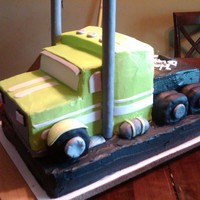 Semi Cake This is sculpted into semi. My nephew is in love with semi's and wanted a semi cake. It is all yellow cake iced with icing and had...