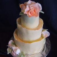 Mini Wedding Cake this is a chokolate fudge cake with strawberry bc filling , covered with butter cream and white chockolate collars, gumpaste roses.. this...