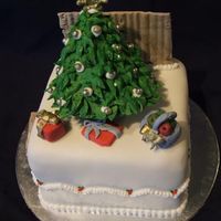 Mini Christmas Cake this is a 4" christmas cake, my mum ordered 4 of them , this one has a story behind it, the fence in the background really , the cake...