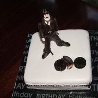 Charlie Chaplin this was a cake a lady ordered from me for her son who is a huge fan of charlie chaplin... the end result had more movie film than what is...