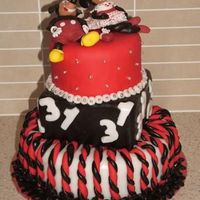 Micky And Minnie Cake this is a 31st birthday cake i made for my friend in november, it is caramel mud cake ( bottom) with rolled buttercream, chock hazelnut...