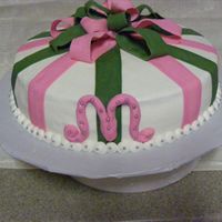 Monogram Buttercream with fondant acents and silver dragees.