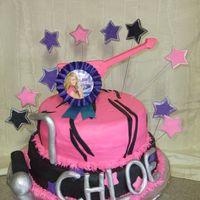 Hannah Montanat Rockstar Made this for a friends daughter. Guitar is chocolate. All the rest of the decorations are fondant. the Hannah Button is not edible :)