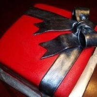 Giftbox.jpg This was a last minute cake for a bridal shower. They wanted the colors to be cranberry red and black BUT I didn't have the time to go...