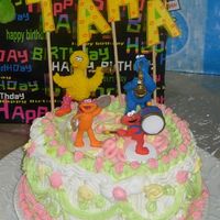 Elmo N Cookie Monster this was my third cake ever about 2 years ago . after this i decided never to decorate a cake again. Then i took wilton course 1 and...