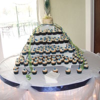 Wedding Cupcake Tree This was my niece's choice for her wedding. I made over 300 cupcakes in vanilla, chocolate and maple flavors, covered in ivory BC. The...