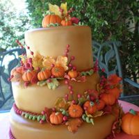 Fall Wedding Cake this one is one of my favorites! i made this for my cousins wedding :) the pumpkins and leaves are make of gum paste and the cake it self...