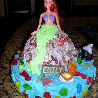 Ariel Ariel sitting on a rock in the middle of the ocean.