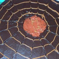 Halloween Cake With Peanut Butter Yummm Chocolate cake, chocolate buttercream icing and peaunut butter with food dye for decorations, in the center it has HH for Happy Halloween...