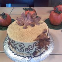 Thanksgiving Cake my first time using luster dust and gum paste wow that stuff is awsome.i used a pumkin spice cake recipe painted gumpaste leaves bc frosing...